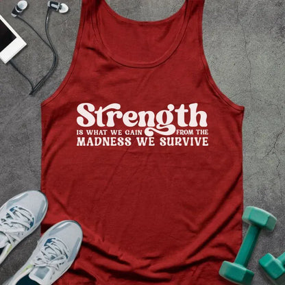 Red tank top printed with "Strength IS WHAT WE GAIN FROM THE MADNESS WE SURVIVE" in white