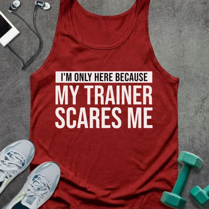Red tank top printed with "I'm Only Here Because my Trainer Scares Me" in white