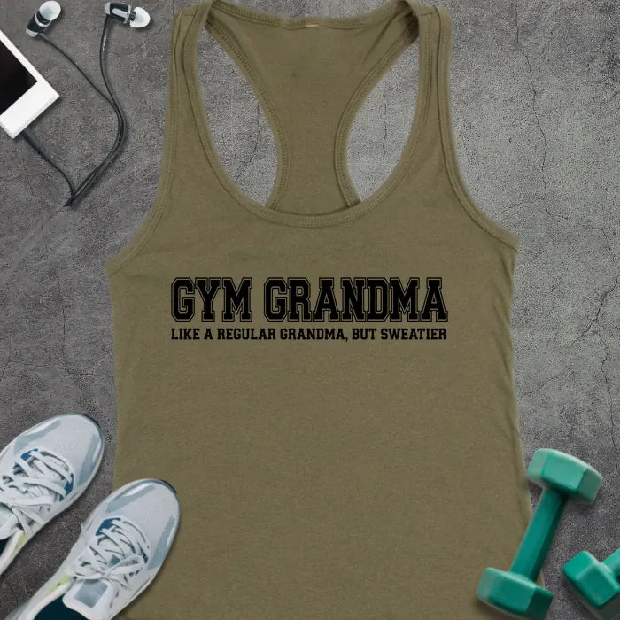 Military green racerback tank top printed with "GYM GRANDMA, LIKE A REGULAR GRANDMA, BUT SWEATIER" in black varsity letters