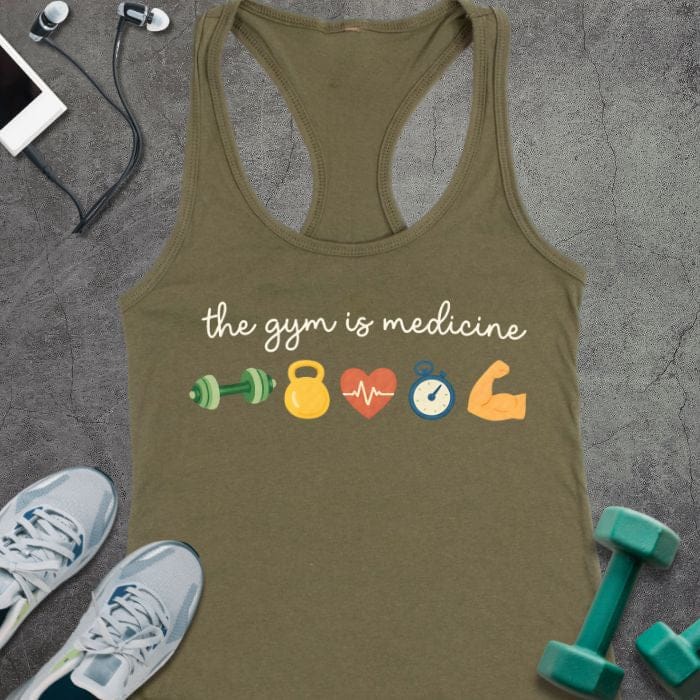 Military green tank top printed with "the gym is medicine" in white and multicolor, with colorful gym icons including dumbbells, kettlebell, heartbeat, and flexed arm