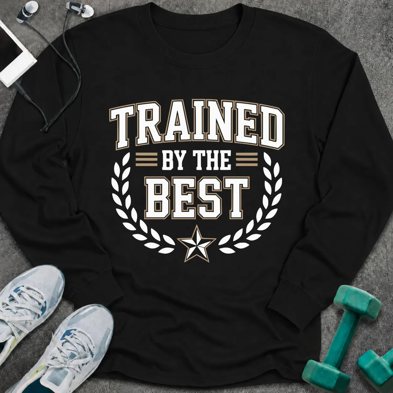 Black long sleeve tee printed with "Trained By The Best" in white, with a laurel wreath and star